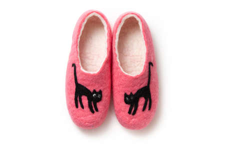 Felt slippers on white background in closeupの写真素材