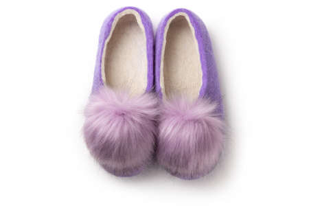 Felt slippers on white background in closeupの写真素材