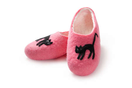 Felt slippers on white background in closeupの写真素材