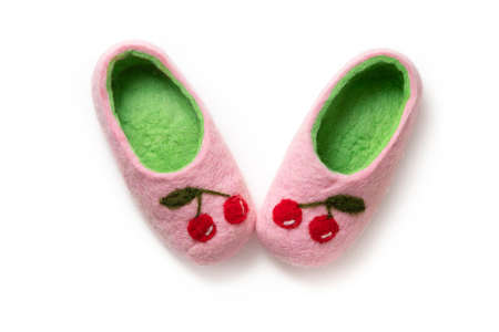 Felt slippers on white background in closeupの写真素材