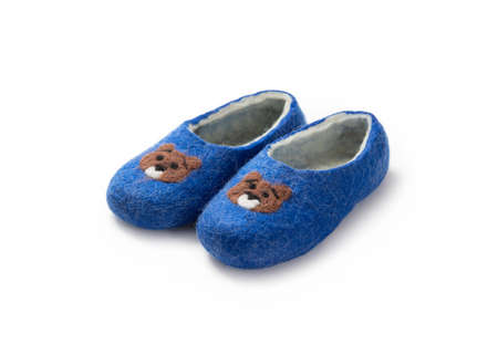 Felt slippers on white background in closeupの写真素材