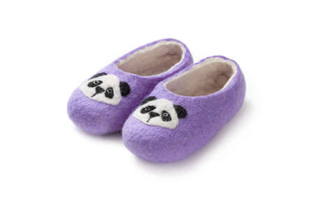 Felt slippers on white background in closeupの写真素材