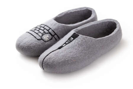 Felt slippers on white background in closeupの写真素材