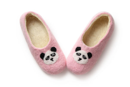 Felt slippers on white background in closeupの写真素材