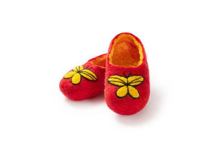 Felt slippers on white background in closeupの写真素材