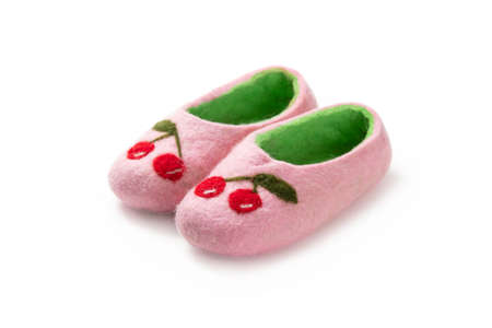 Felt slippers on white background in closeupの写真素材