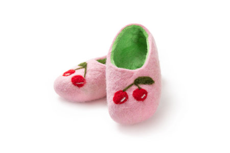 Felt slippers on white background in closeupの写真素材