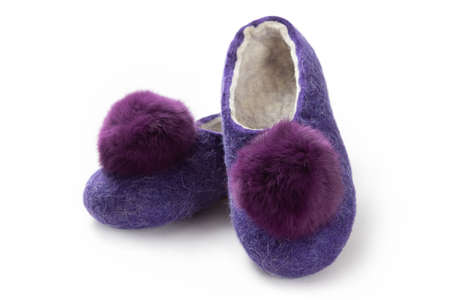 Felt slippers on white background in closeupの写真素材