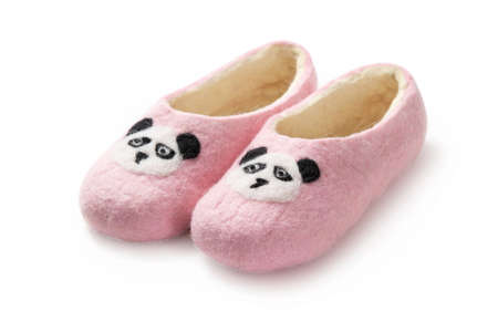 Felt slippers on white background in closeupの写真素材