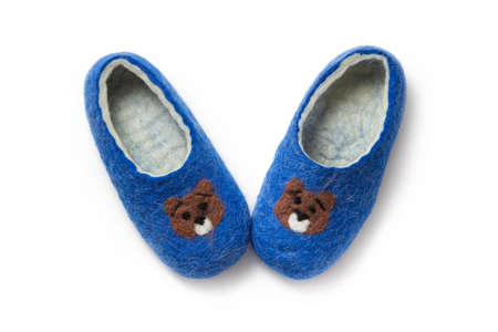 Felt slippers on white background in closeupの写真素材