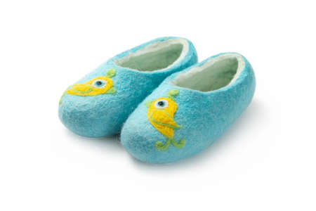 Felt slippers on white background in closeupの写真素材
