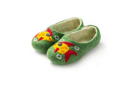 Felt slippers on white background in closeupの写真素材