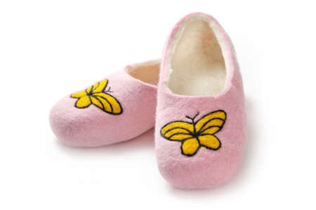 Felt slippers on white background in closeupの写真素材