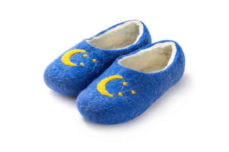 Felt slippers on white background in closeupの写真素材