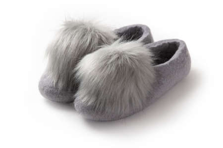 Felt slippers on white background in closeupの写真素材