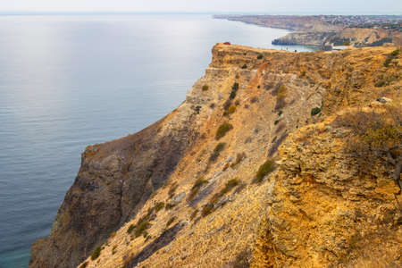 Red car on a high cliffの写真素材