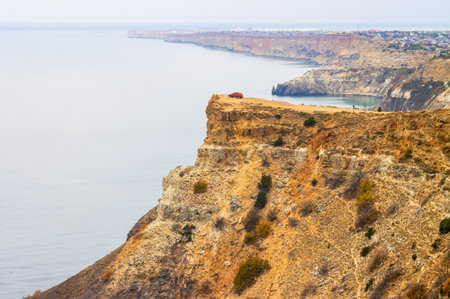Red car on a high cliffの写真素材