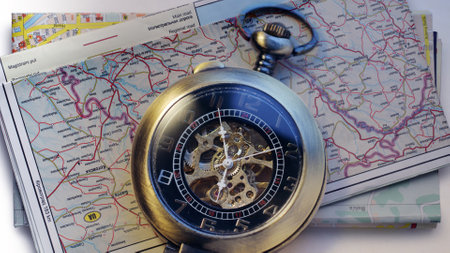 Pocket watch with two road mapsの写真素材