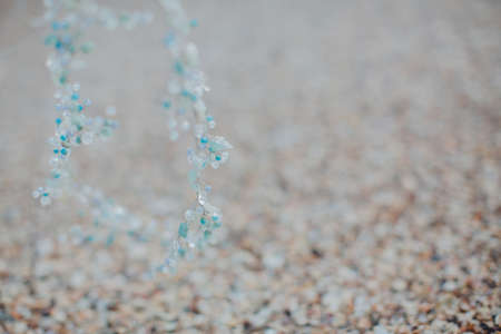 blurred background with wreath of blue beadsの写真素材