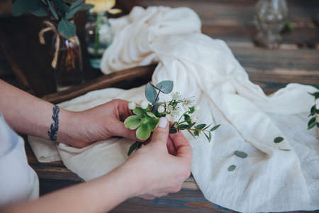 The preparation of the bonbonniere. Florist shop, wedding preparation.
