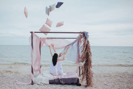 Morning on the beach young coupleの写真素材