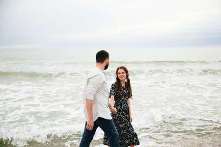 Picture of romantic young couple on the sea shoreの写真素材