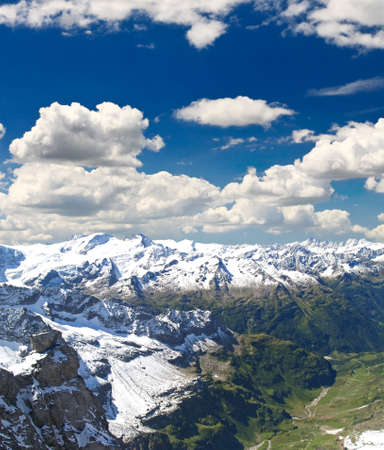 A snow covered mountains at summer time in Swizerlandの写真素材