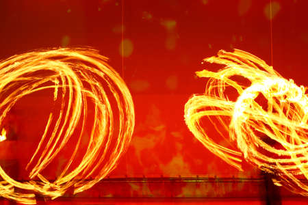 A fire show performed on stage in a beach resortの写真素材