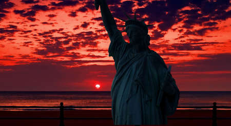 The Statue of Liberty at a beautiful sunset  の写真素材