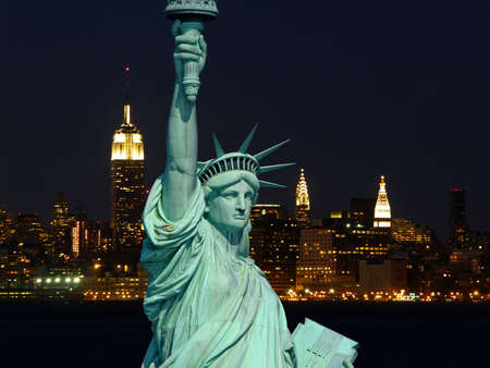 The Statue of Liberty and New York City skylines as the background