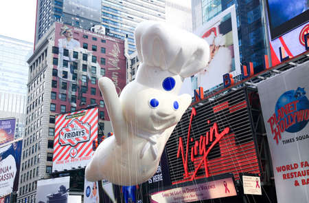 MANHATTAN - NOVEMBER 26 : A Pillsbury Doughboy balloon passing Times Square at the Macy's Thanksgiving Day Parade November 26, 2009 in Manhattan.のeditorial素材