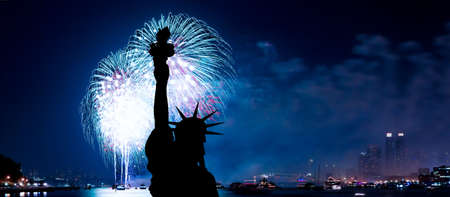 The silhouette of Statue of Liberty Statue of Liberty and July 4th fireworks over Hudson Riverの写真素材