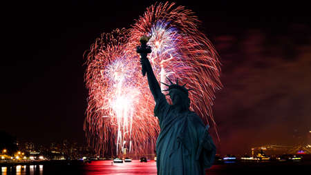 The silhouette of Statue of Liberty Statue of Liberty and July 4th fireworks over Hudson Riverの写真素材