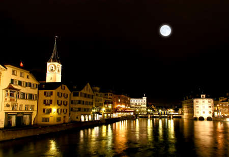St. Peter's Church tower with Europe?s largest church clock face in Zurich at nightの写真素材