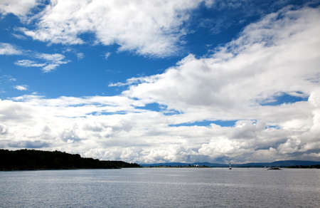dramatic cloudscape in the harbor of Oslo Norwayの写真素材