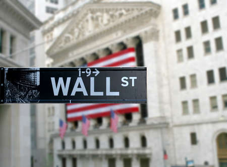 Wall street sign with New York Stock Exchange background Wall street sign with New York Stock Exchange background