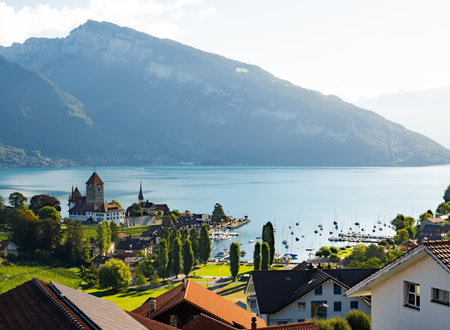 Aerial view of Spiez Church and Castle on the shore of Lake Thun in the Swiss canton of Bern, Spiez,...