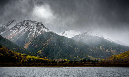 Autumn scenery. Fog lifting over Red Mountains 1, 2 and 3 along the Million Dollar Highway in the San Juan Mountains of Colorado.の写真素材
