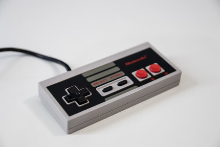 A Nintendo Games console controller for a nintendo entertainment system or NES released in 1983のeditorial素材