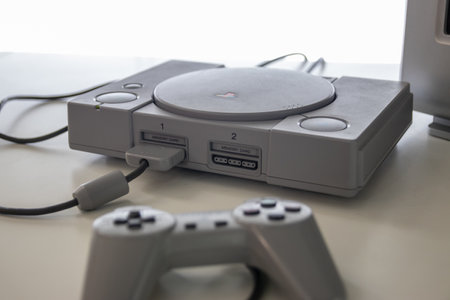 A sony Playstation one and controller a games console released in 1994 by sonyのeditorial素材