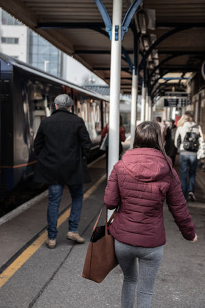 09/14/2019 Portsmouth, Hampshire, UK Train passengers or commuters leaving an train at a station