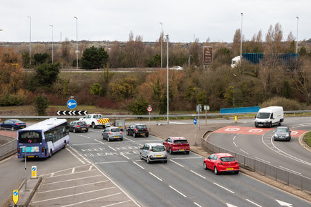 09/14/2019 Portsmouth, Hampshire, UK traffic approaching a roundabout on british roadsのeditorial素材