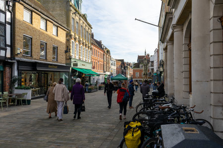 11/06/2019 Winchester, Hampshire, UK Winchester High street with shoppers passing through, a typical old english high streetのeditorial素材