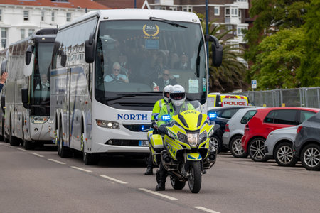 09/14/2019 Portsmouth, Hampshire, UK a police motorbike officer at the front of a motorcade escortのeditorial素材