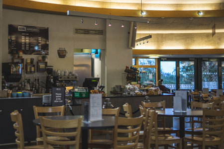 01/11/2020 Portsmouth, Hampshire, UK the interior of a cafe with chairs tables and a counter for serving customersのeditorial素材