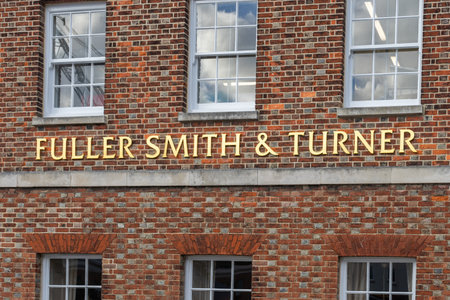 11/03/2019 Portsmouth, Hampshire, UK a duller smith and turner pub sign on a brick backgroundのeditorial素材