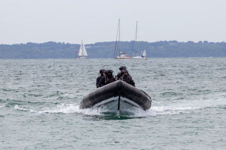 09/14/2019 Portsmouth, Hampshire, UK british police patrolling in a rigid inflatable boat on the seaのeditorial素材