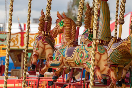 09/14/2019 Portsmouth, Hampshire, UK the painted horses on a traditional english carousel rideのeditorial素材