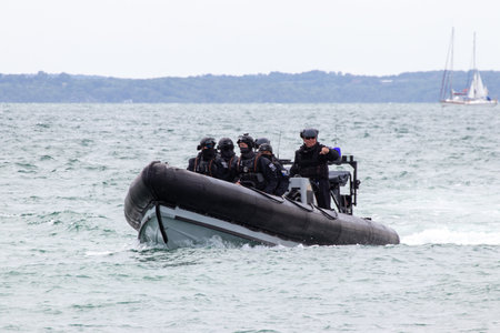 09/14/2019 Portsmouth, Hampshire, UK british police patrolling in a rigid inflatableのeditorial素材