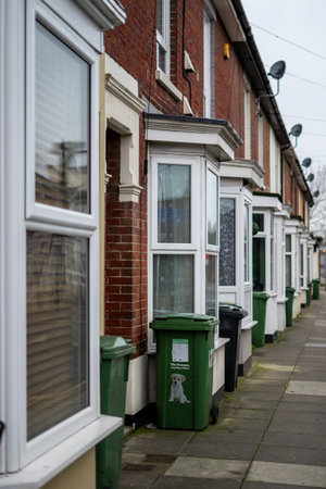 01/23/20 Portsmouth, Hampshire, UK The exterior of typical english brick terraced houses with green wheelie bins at the frontのeditorial素材